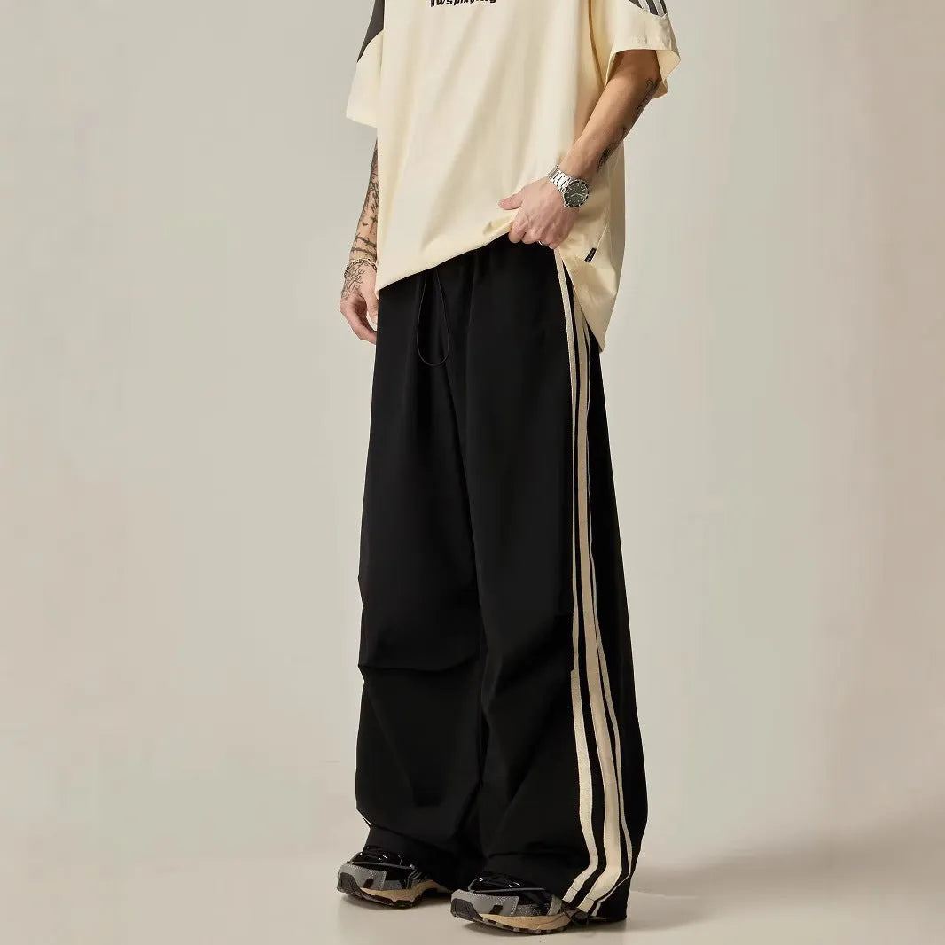 Men's black wide leg climbing trousers with high waist and straight leg design on mannequin