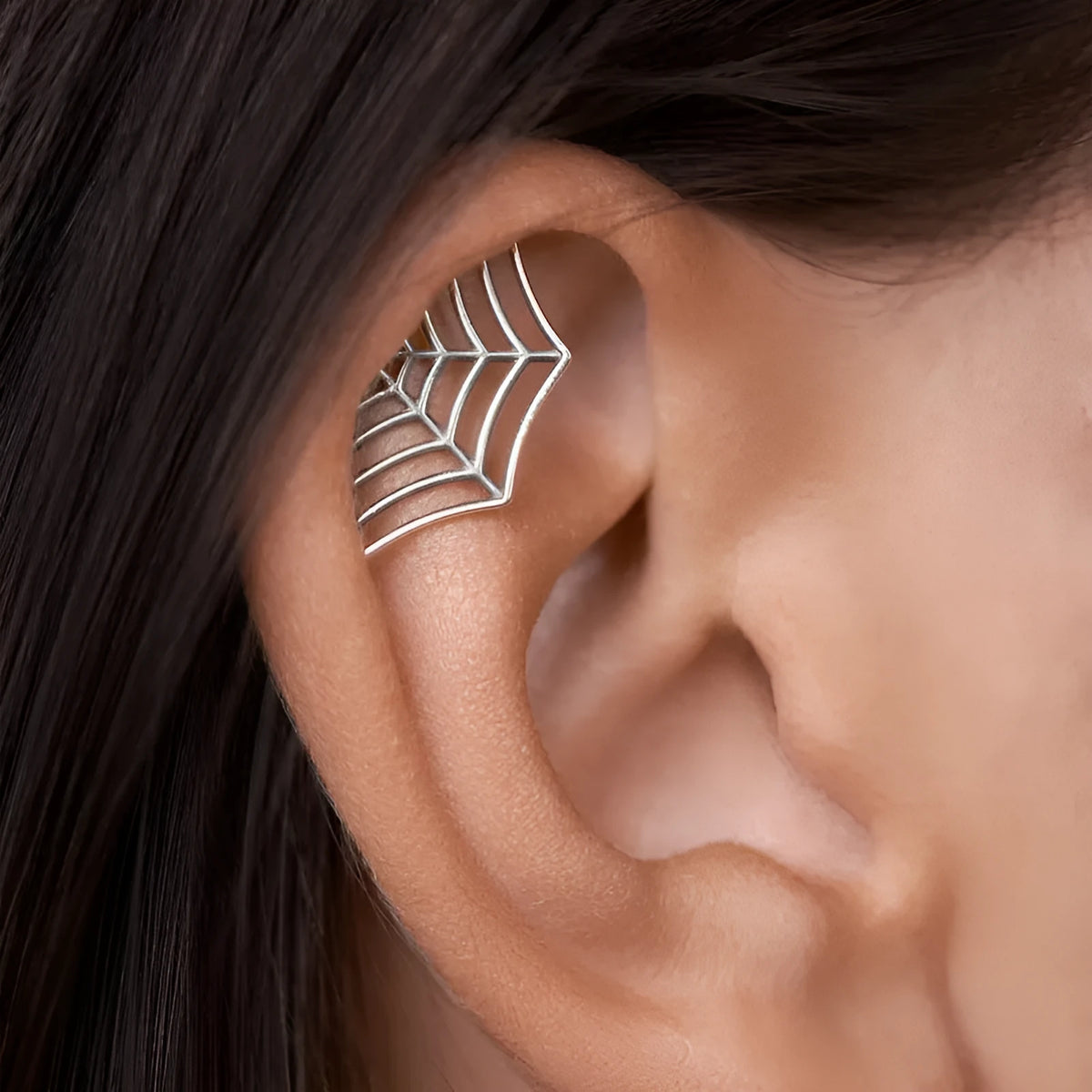 Spider web stud earrings with geometric mesh design in gold and silver electroplated metal