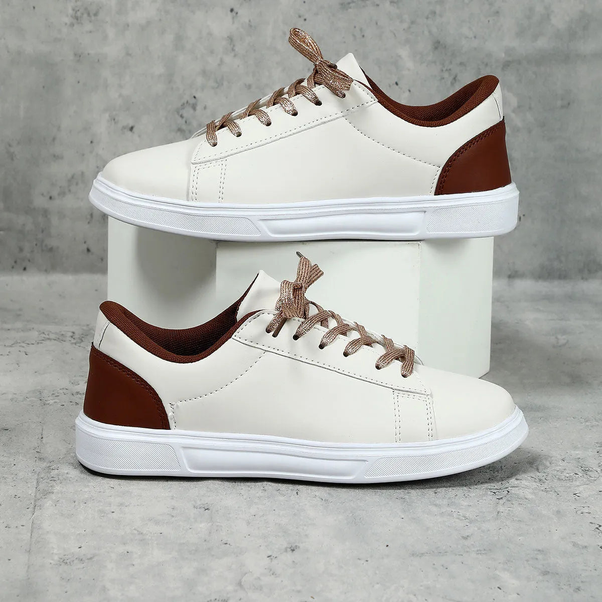 Casual platform sneaker with cross strap detail on artificial PU upper in beige brown colour