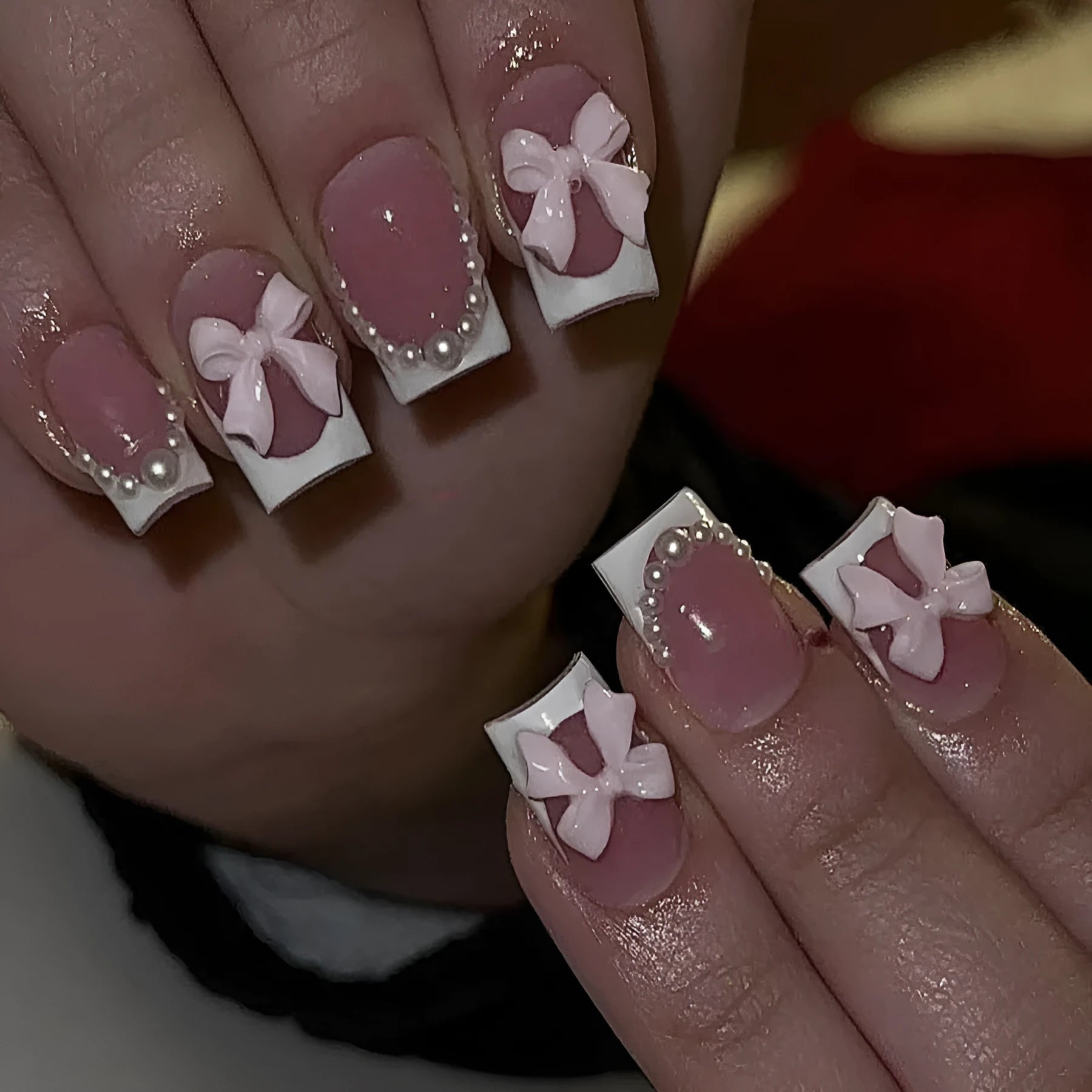 Short white French manicure press-on nails with bow designs and multiple patterns