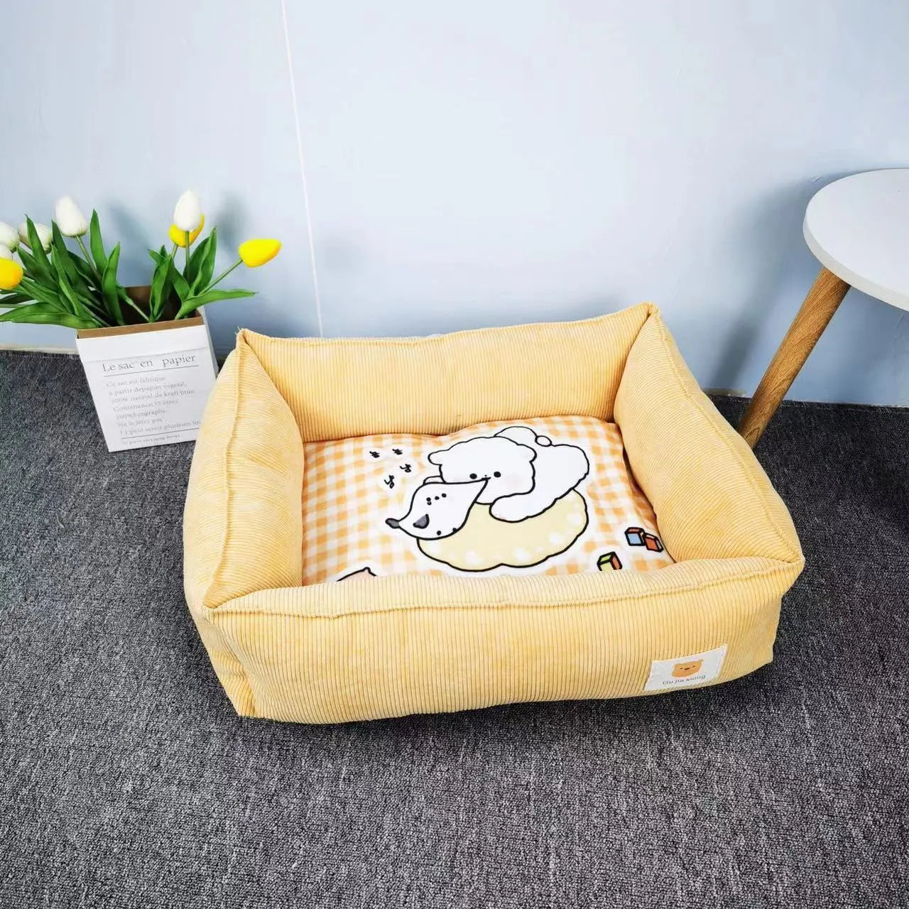 Rectangular cloth pet nest for dogs and cats in a choice of colours, shown in two available sizes.