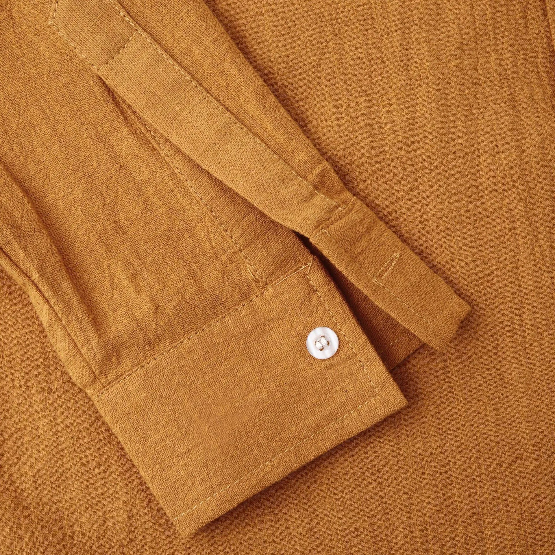 Men's brown slim fit long sleeve cotton blend shirt laid flat.