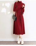 Turtleneck knitwear dress with elastic waist and loose big hem in polyester fabric