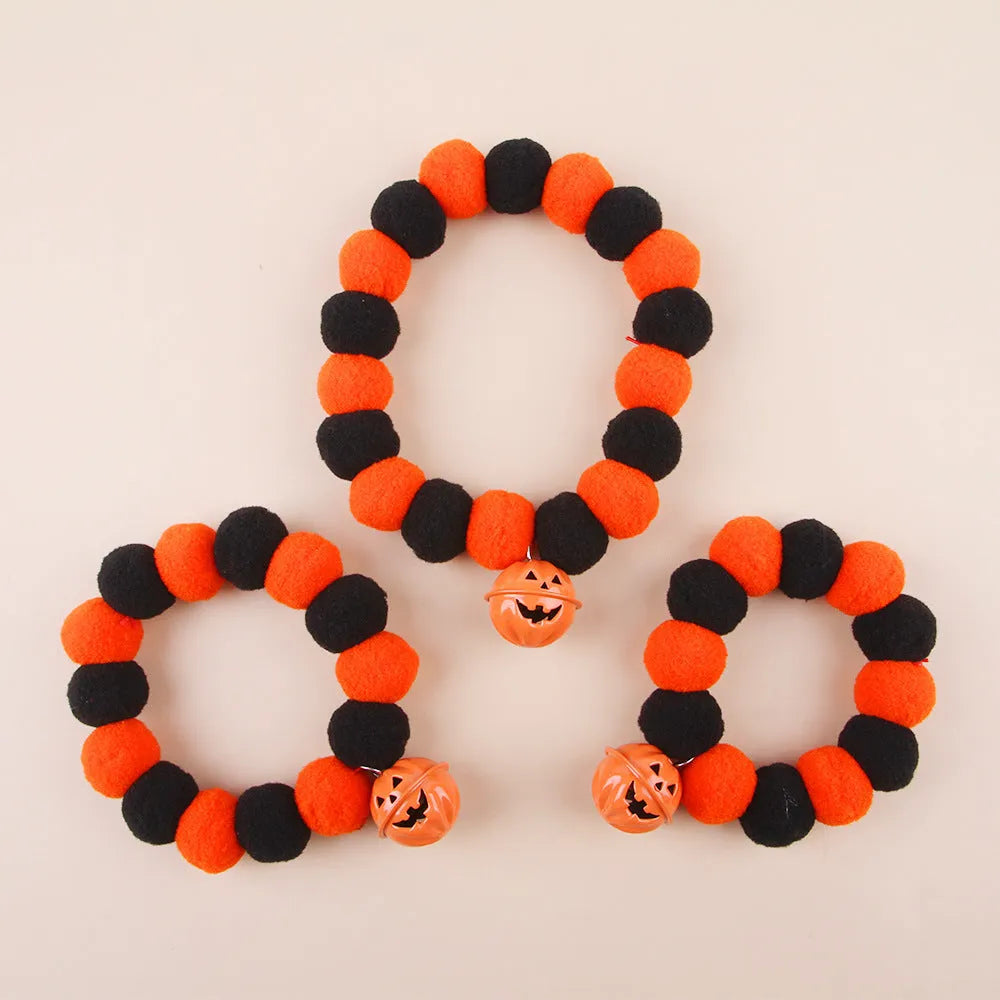 Halloween cat collar with orange pumpkin design showing trick or treat text and ghost bat decorations