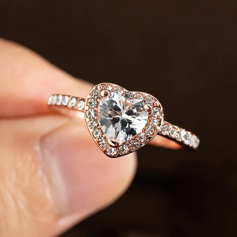 Heart-shaped crystal wedding ring with electroplated rose gold or silver finish on white copper