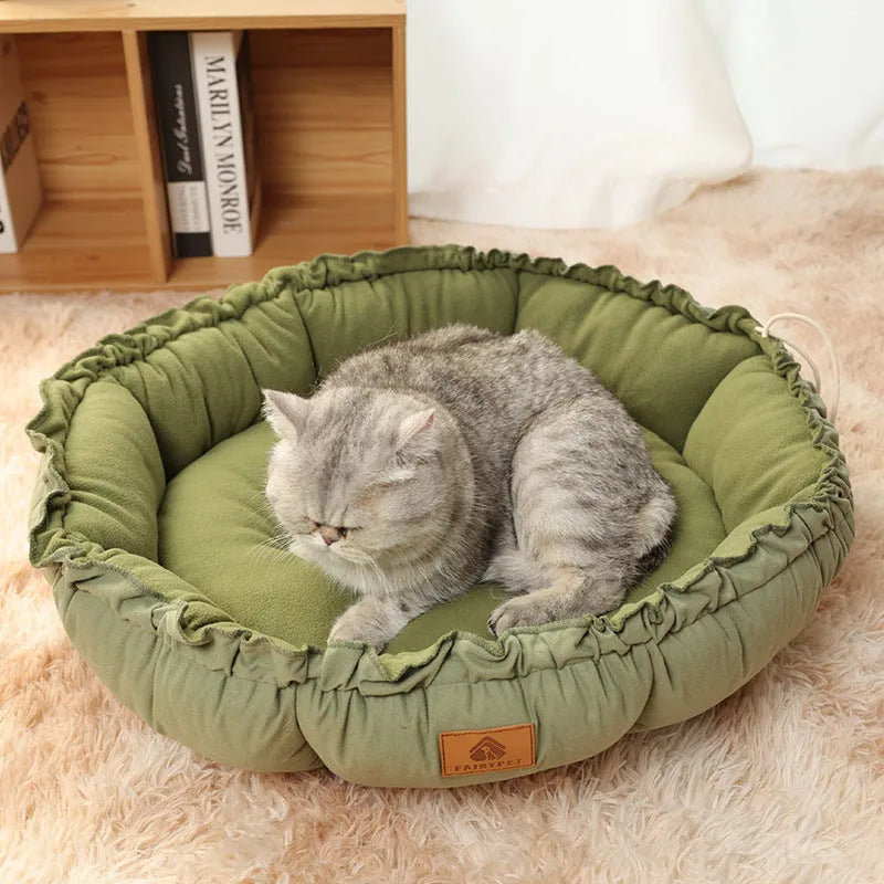Grey reversible donut cat bed shown in both its donut shape and flipped over to its flat pad side.