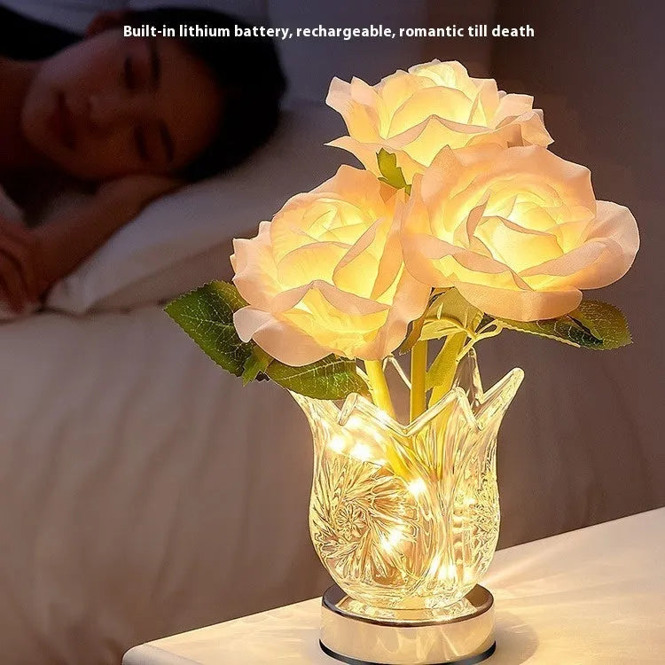 Modern crystal flowers design rechargeable touch table lamp with USB cable on a wooden surface.