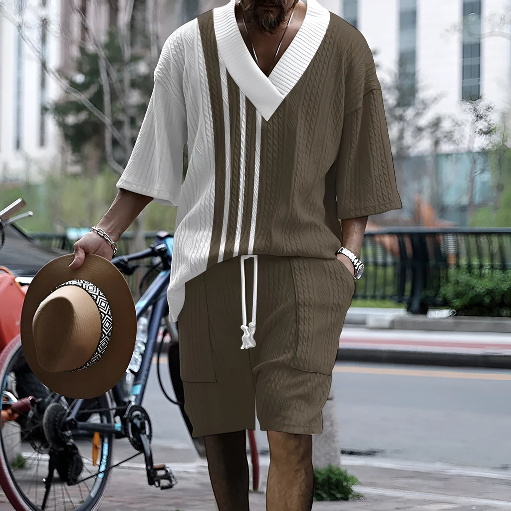 Men's grey printed knitted shorts suit with drop-shoulder short-sleeved top on a hanger.