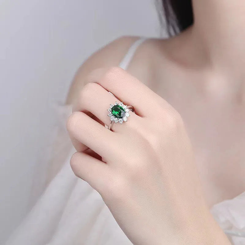 Women's copper flower-shaped ring with inlaid zirconium stones in green, blue, or red.