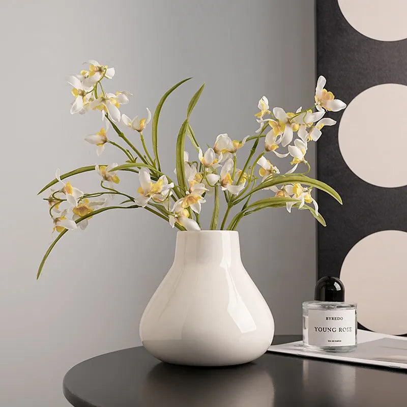Ceramic round belly French vase with orchid flowers in black or white colour options