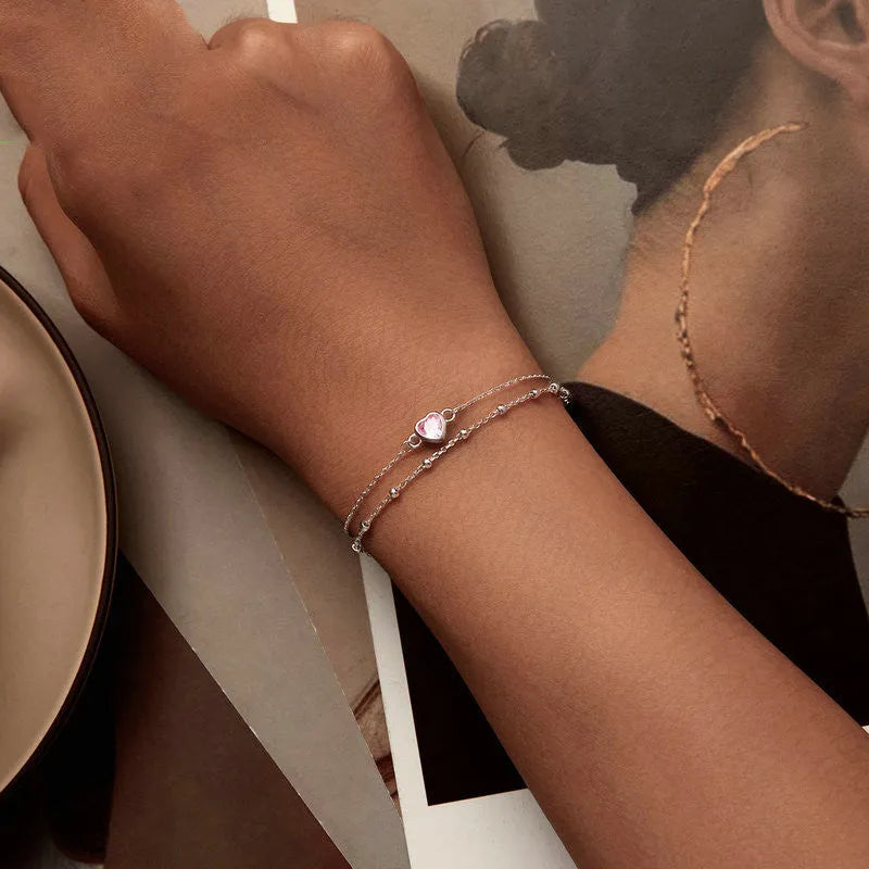 Women's sweet heart-shaped 925 sterling silver bracelet with adjustable chain on wrist