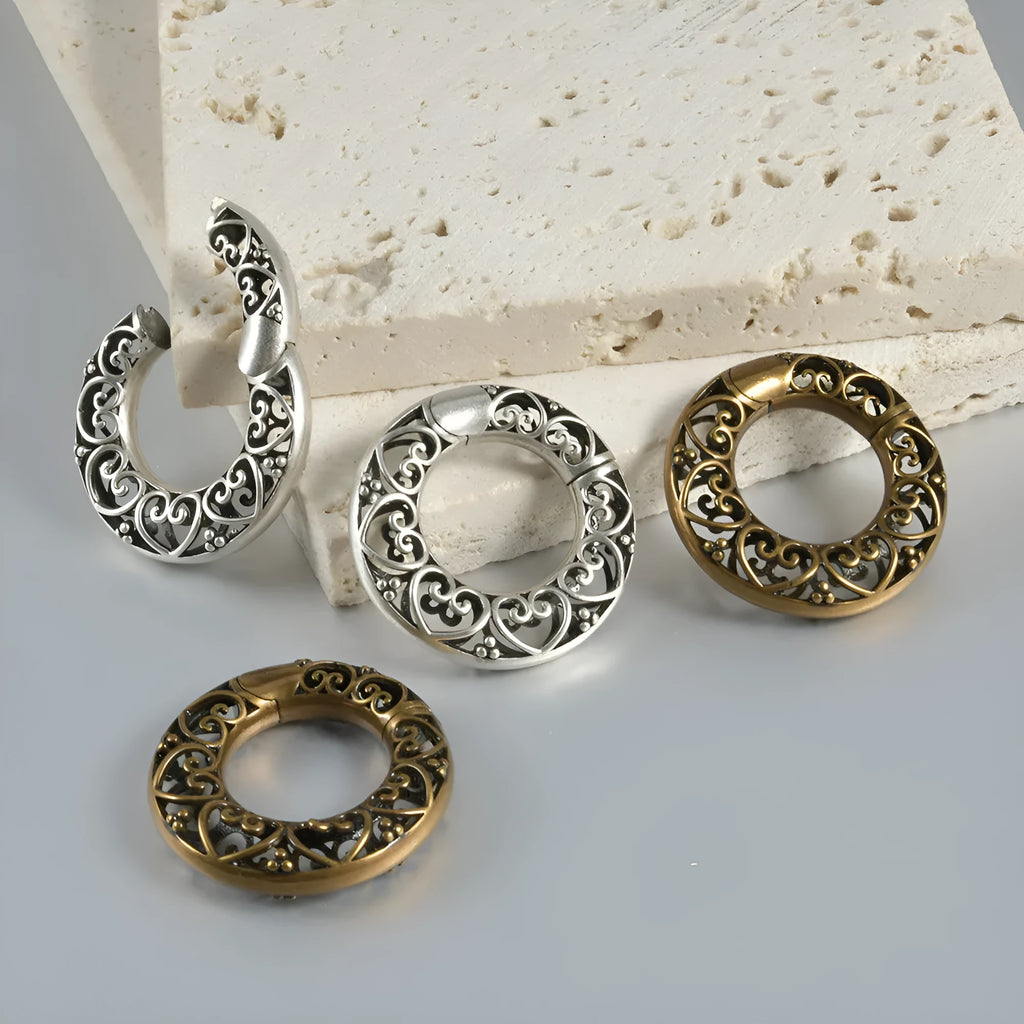 Polished stainless steel retro magnetic earrings featuring hollow heart and lotus geometric shapes in antique silver and gold finishes