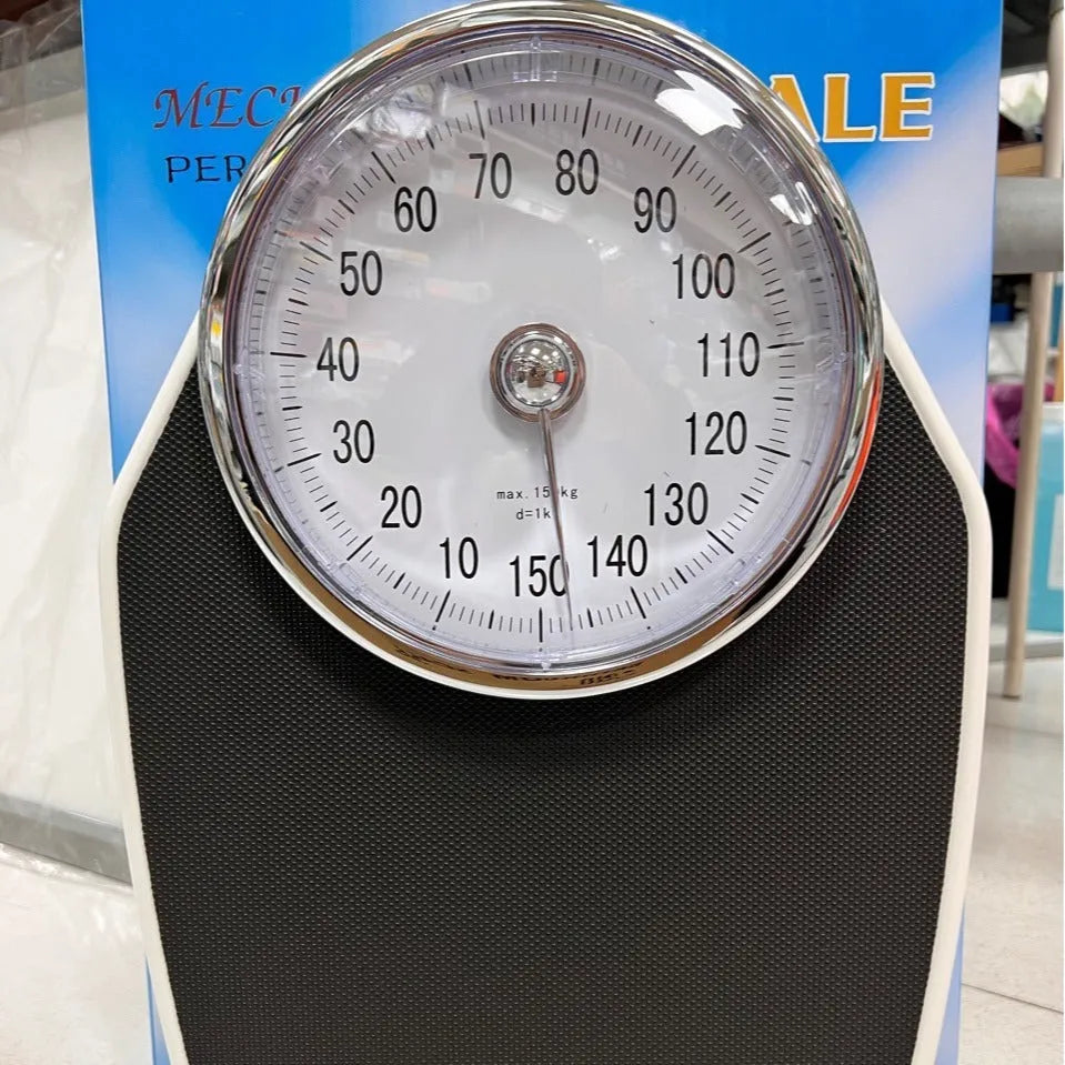 Black mechanical bathroom scale with large analogue dial on a 47x35cm platform.