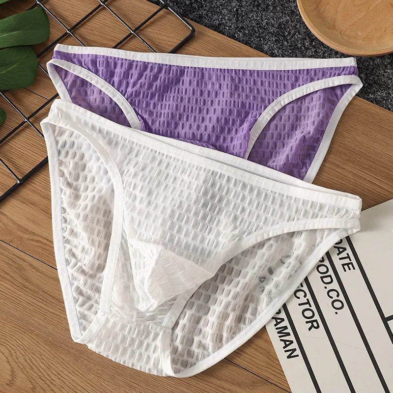 Men's low waist transparent lace underwear in black, shown flat