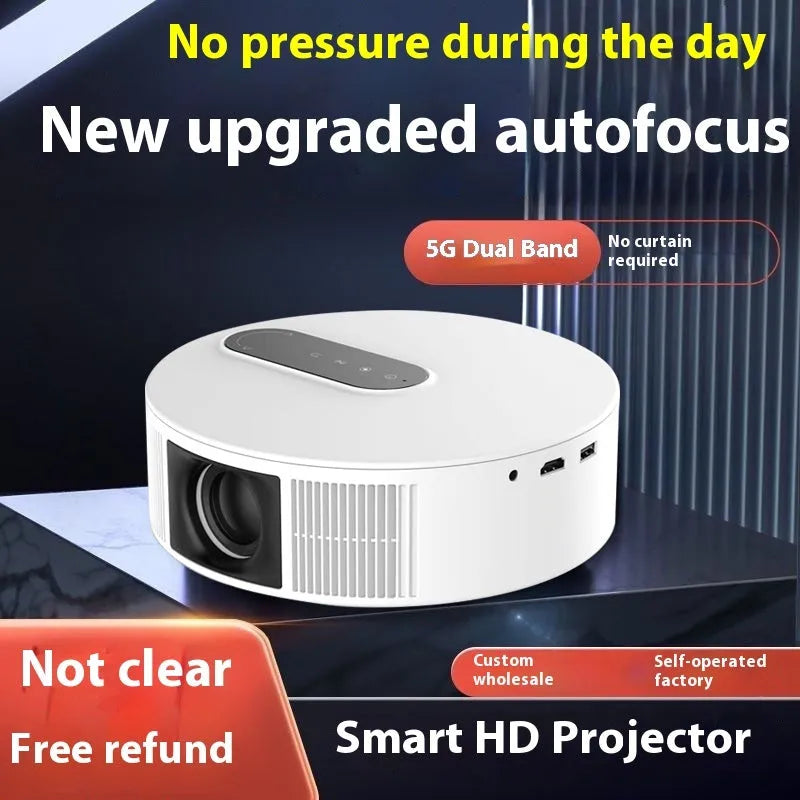 White 720p HD home cinema projector with remote control on a table.