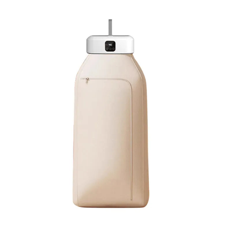 White cylindrical compact laundry dryer with remote control on countertop