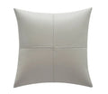 Solid-colour soft cowhide leather pillow cover on a sofa in a Nordic-style living room.