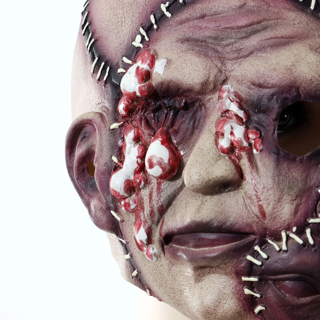 Three-sided grimace horror mask showing realistic facial texture made from natural latex