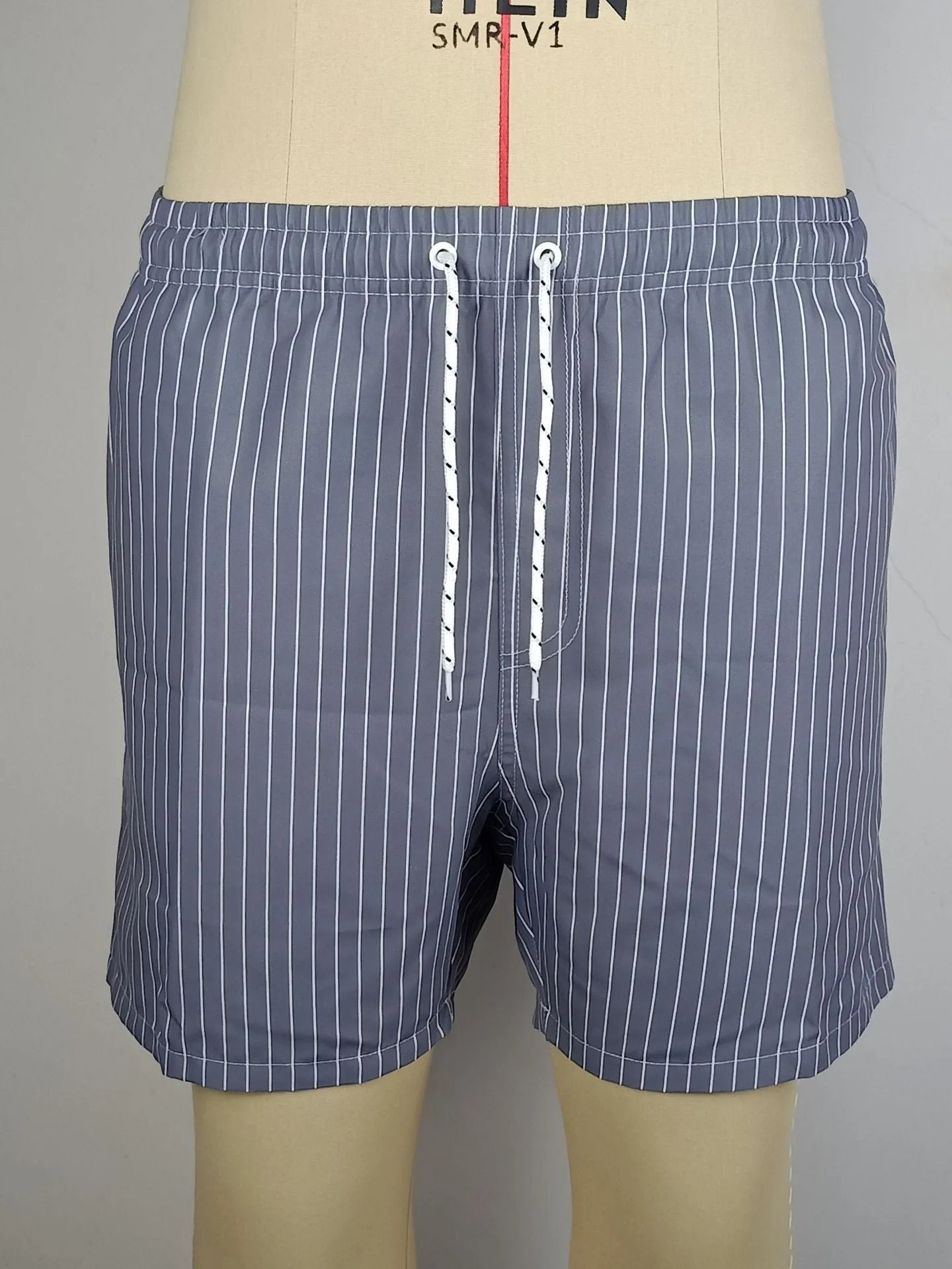 Polyester striped beach shorts with triangle lining pattern in multiple colours