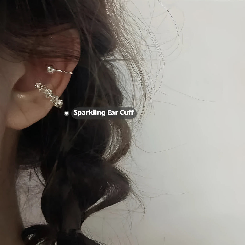 A pair of silver-toned geometric clip-on earrings with an irregular frosty finish and double drop design.