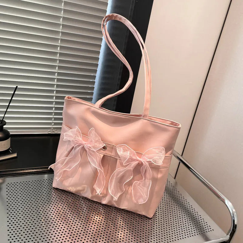 College style bow tote bag in PU leather with double shoulder straps and internal zipper organiser