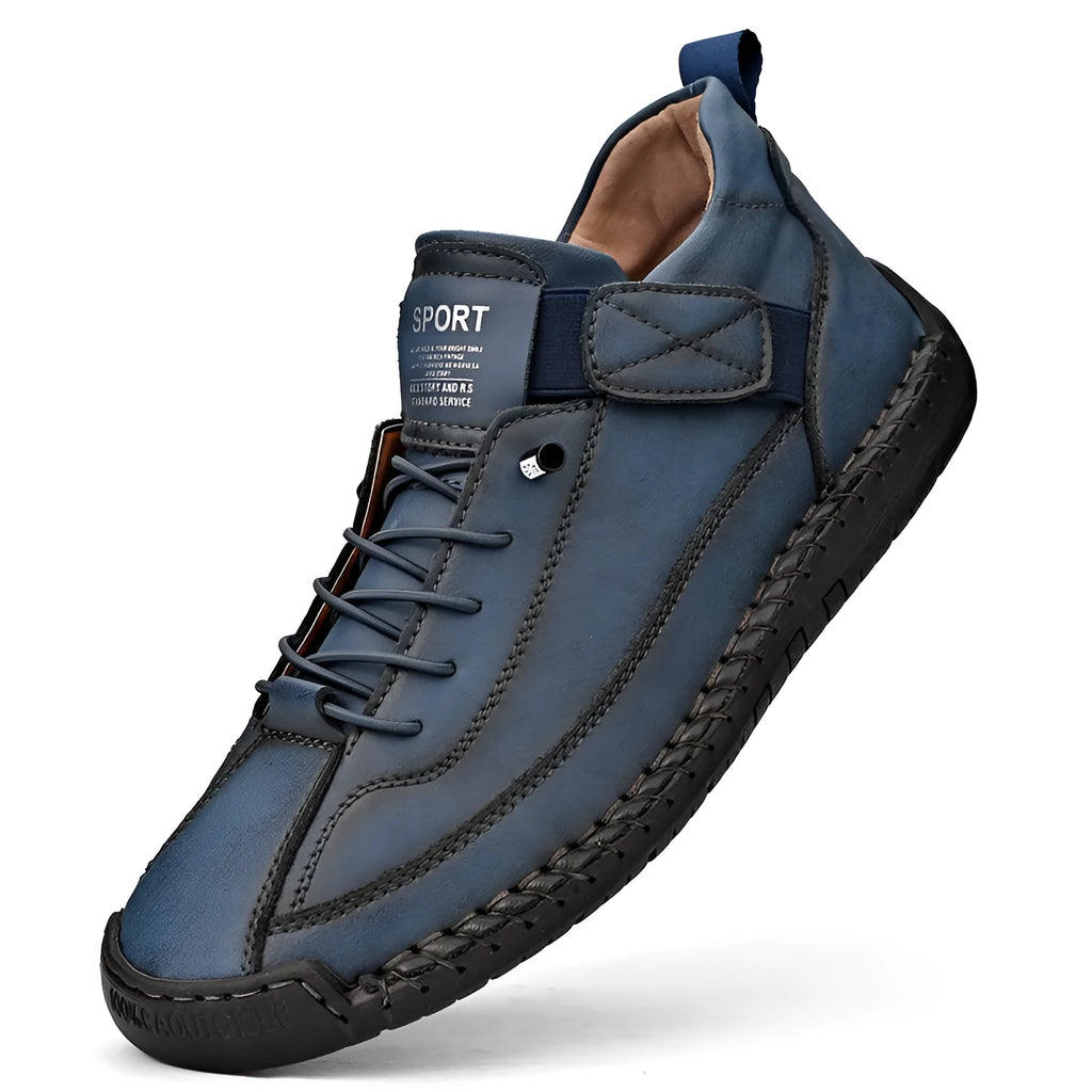 Men's mid-calf black Martin boots with tooling stitching and an elastic band side closure.