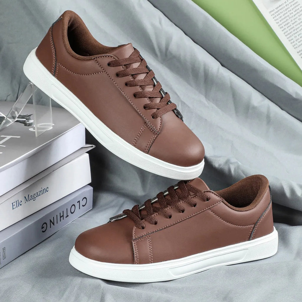 Casual platform sneaker with cross strap detail on artificial PU upper in beige brown colour