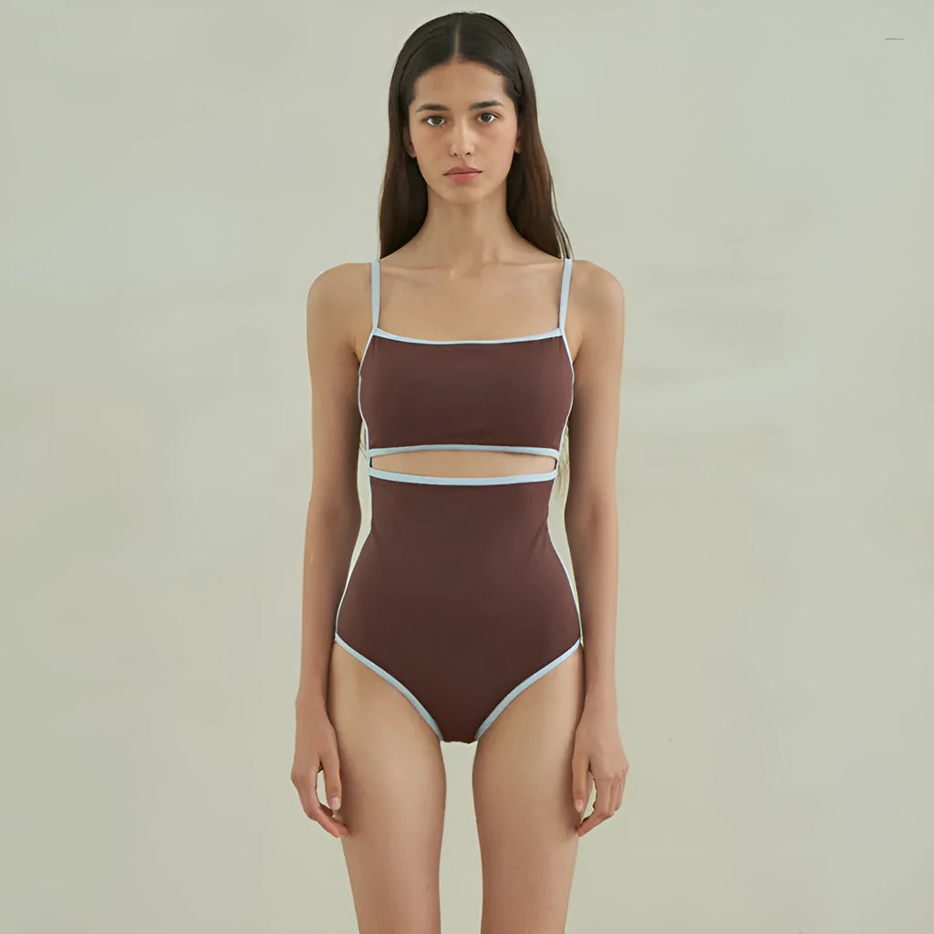 Brown women's one-piece swimsuit with triangle neckline on a hanger.