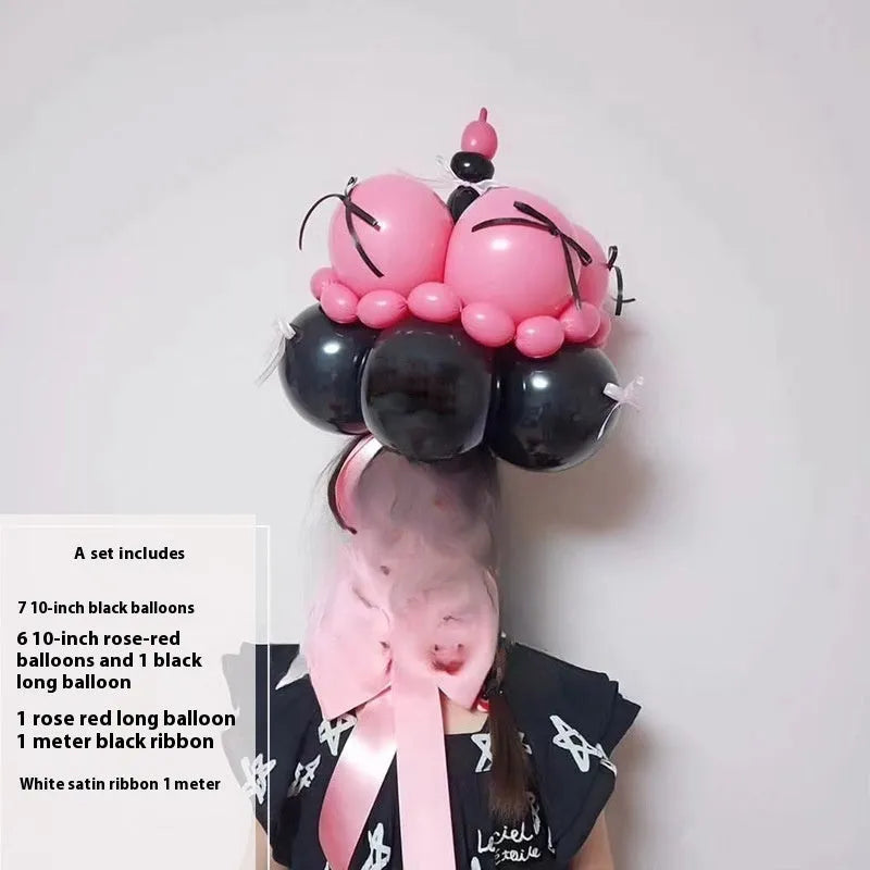 DIY balloon bouquet cake kit with assorted coloured balloons and a clear centrepiece balloon for party decorations.