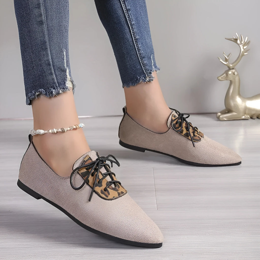 Beige leopard print women's pointed toe pumps with a faux PU upper and rubber sole.