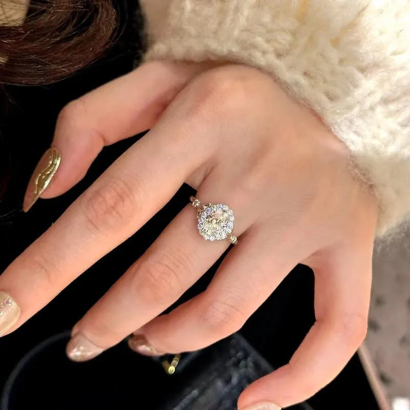 Silver geometric ellipse ring with diamond treatment and adjustable opening mechanism