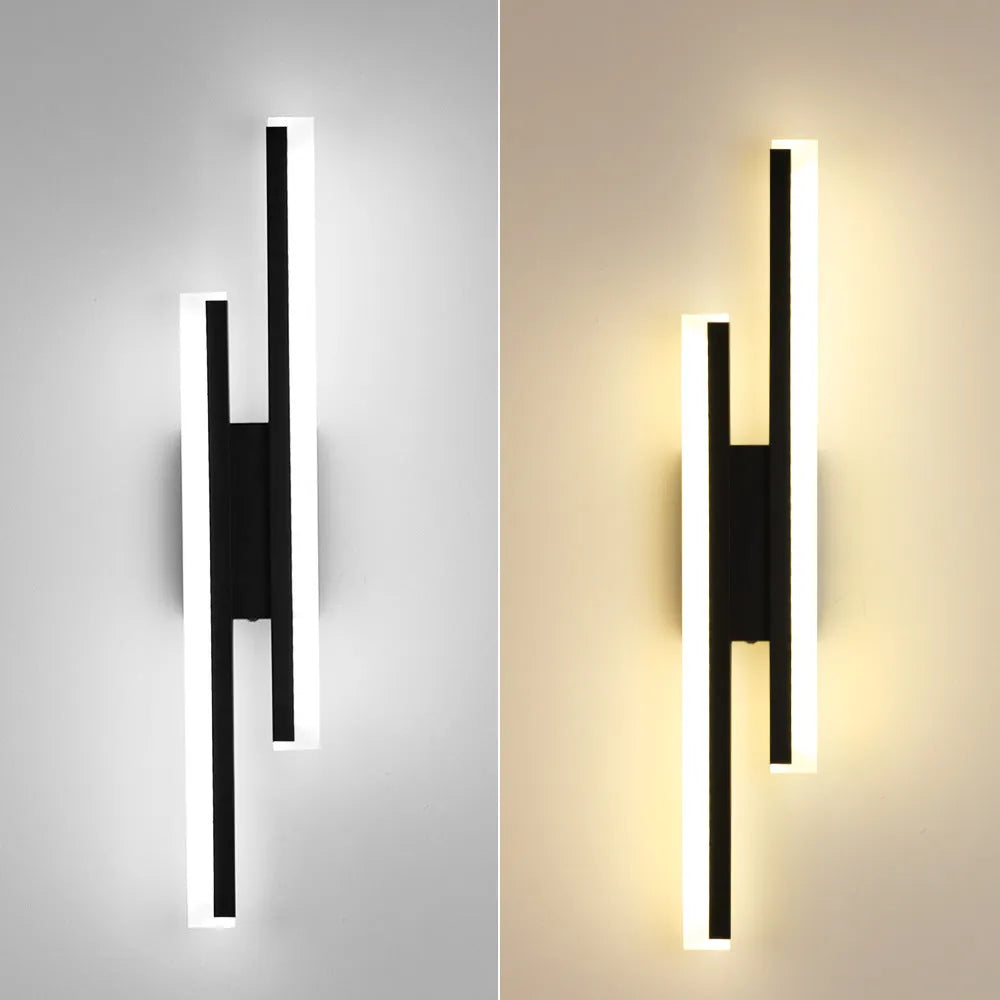 Modern gold and white 500mm double line wall lamp on a plain wall.