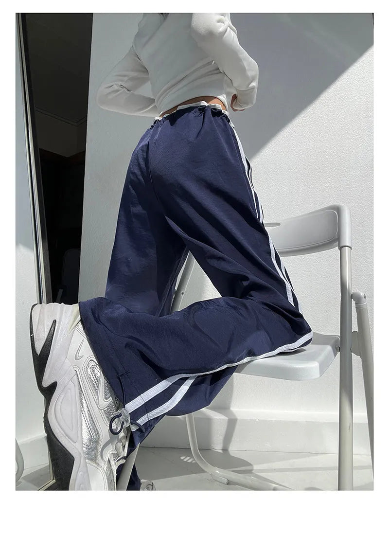 Women's navy blue loose straight leg trousers with white ribbon contrast pattern detail