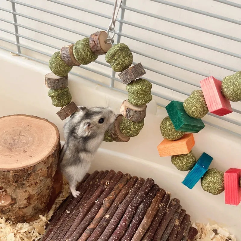 Decorative straw ball ring chew toy for small pets like hamsters, shown in sequin and applewood designs.