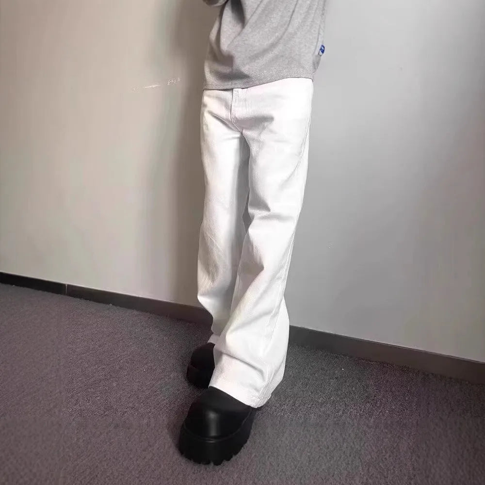 Men's white straight-leg cotton denim jeans on a plain background.