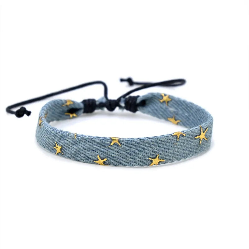 Denim fabric bracelet carrying strap with mixed materials and unisex design