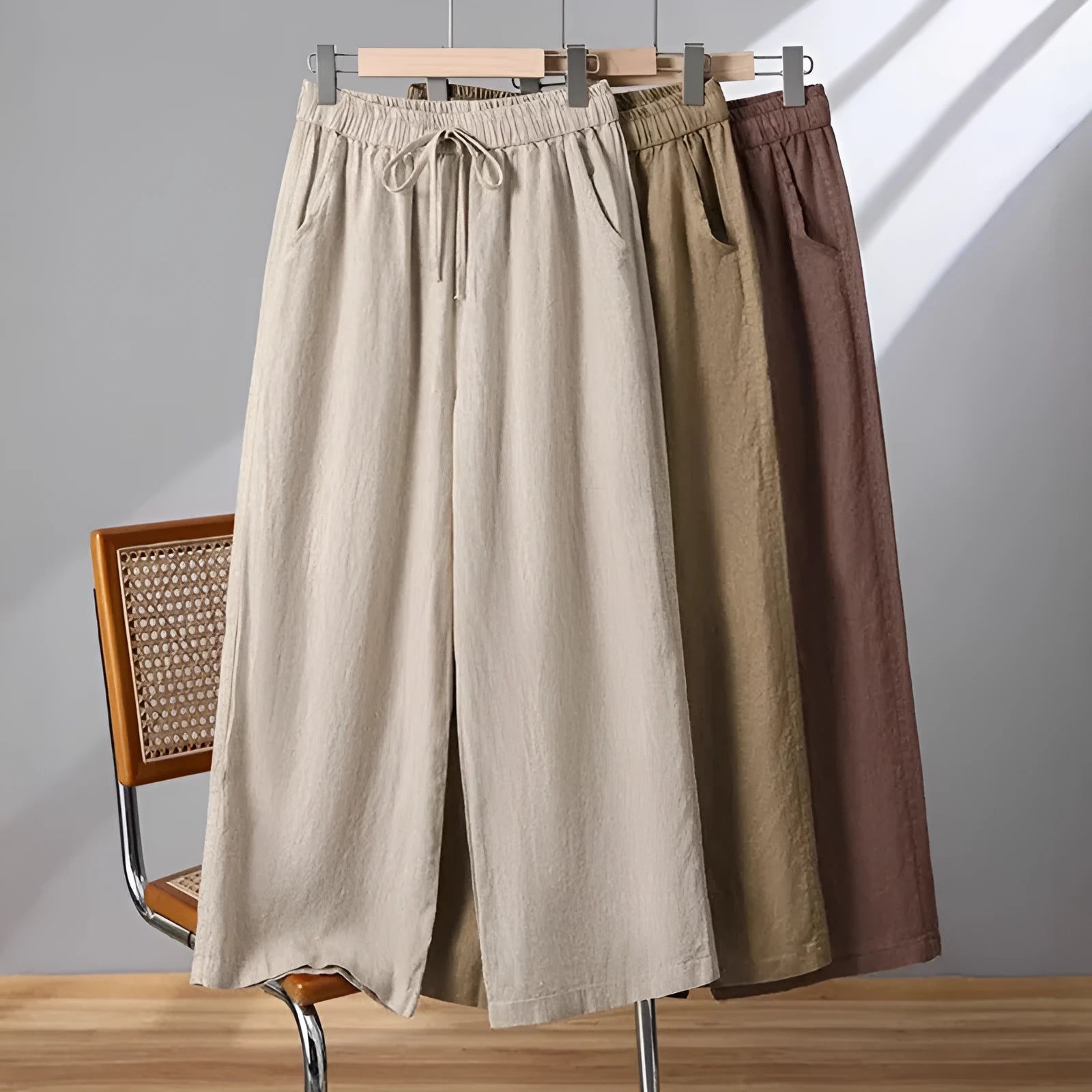 Women's straight-leg casual trousers in apricot colour with an elastic and drawstring waistband.