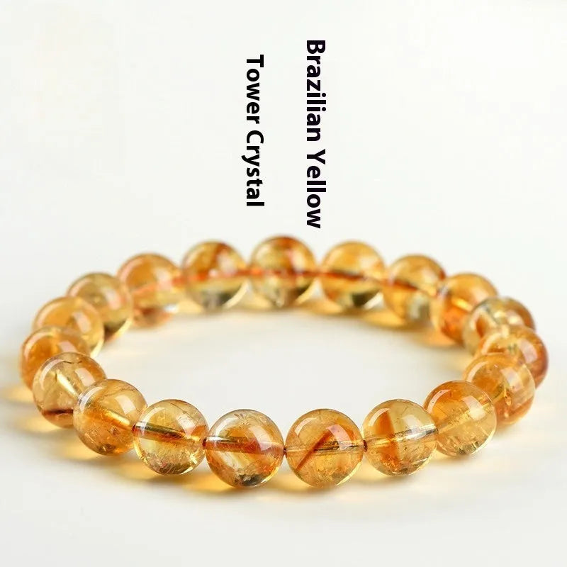Natural yellow citrine gemstone bracelet showing geometric cut beads on a string.