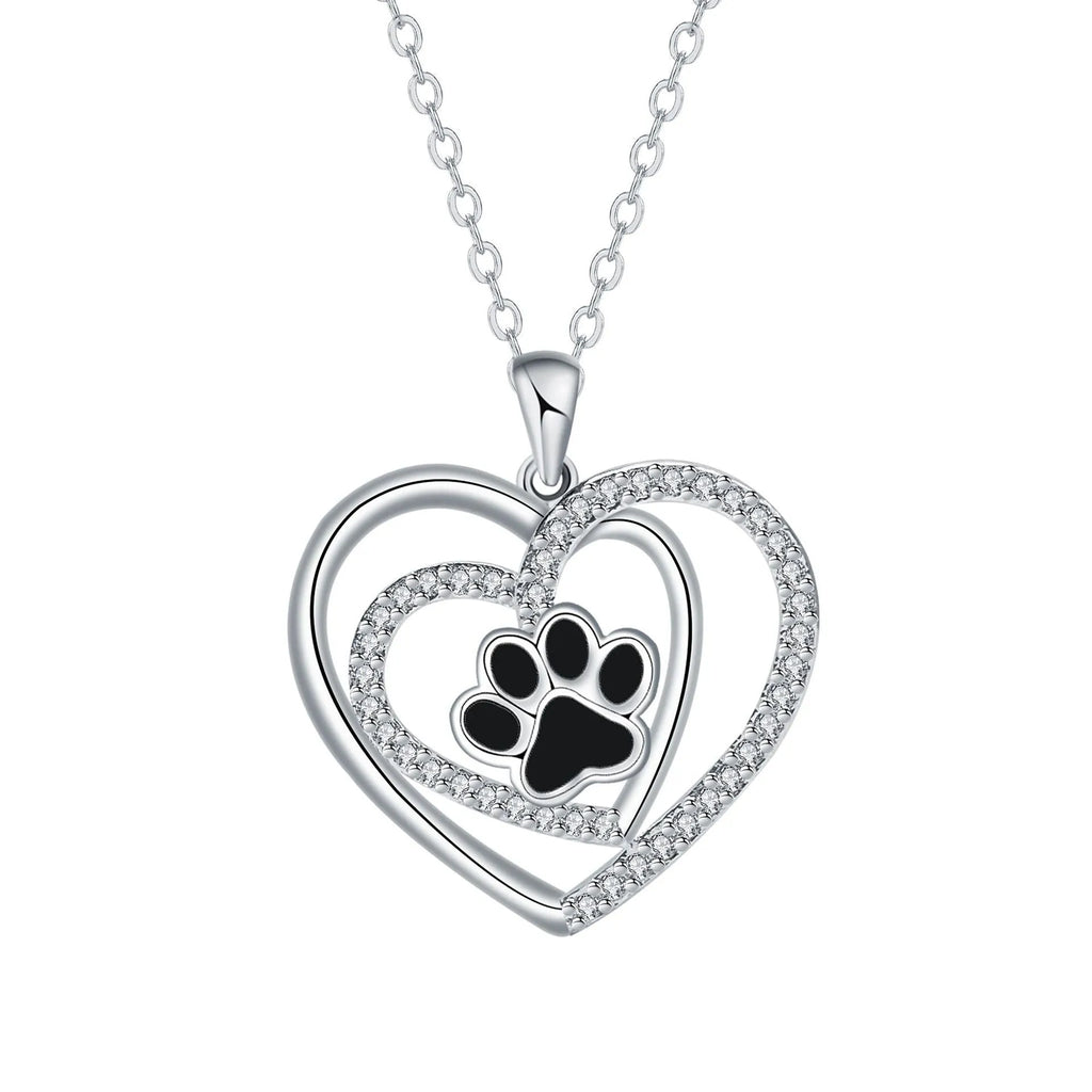 Original design heart-shaped copper necklace with a detailed dog paw print pendant on a cross chain.