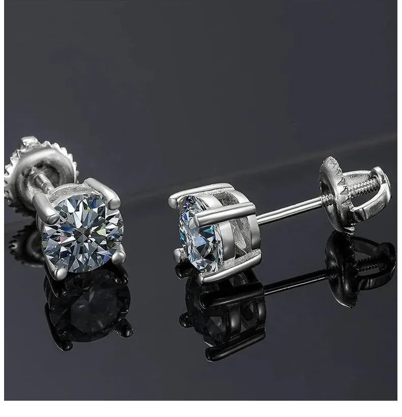 Geometric silver four claw moissanite stud earrings with screw back on black card.