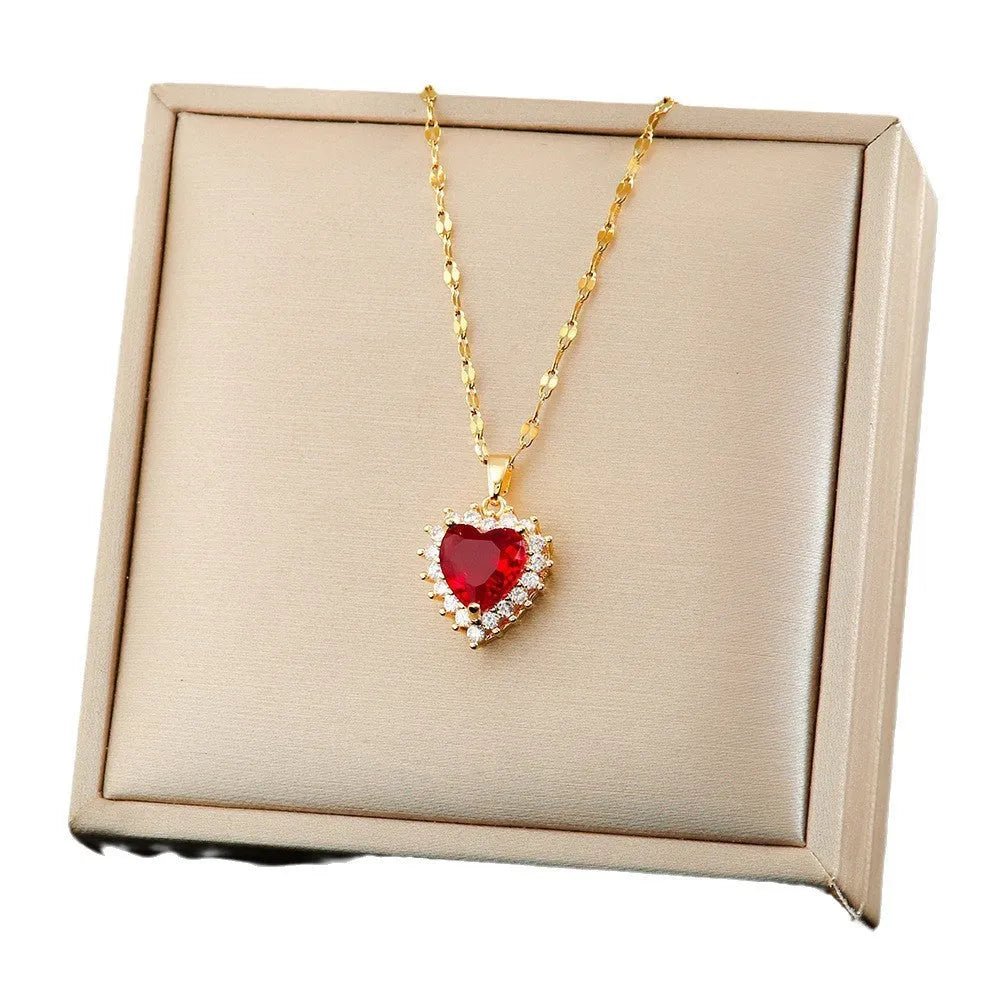 Women's titanium steel heart necklace with floral design and matching earrings and ring set in gold-red electroplated finish