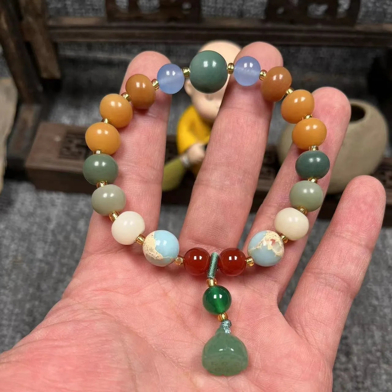 Carved bodhi root pumpkin lotus bracelet with white jade beads and mixed sizing