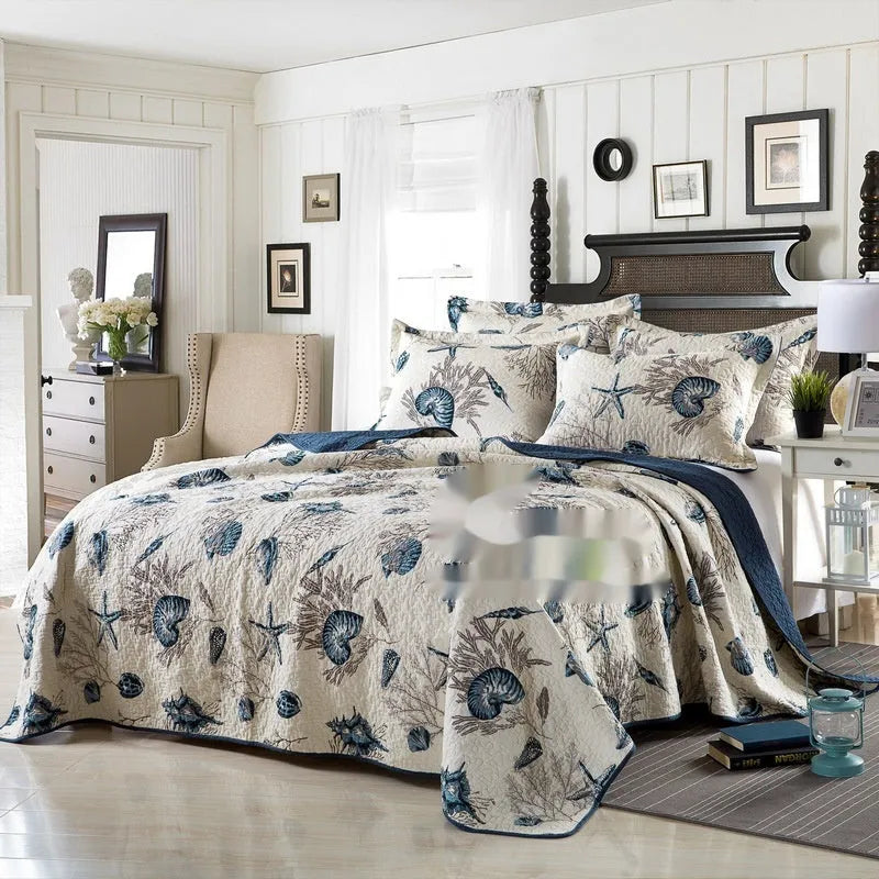 Quilted cotton bed cover set with printed pattern including bedspread and two pillowcases