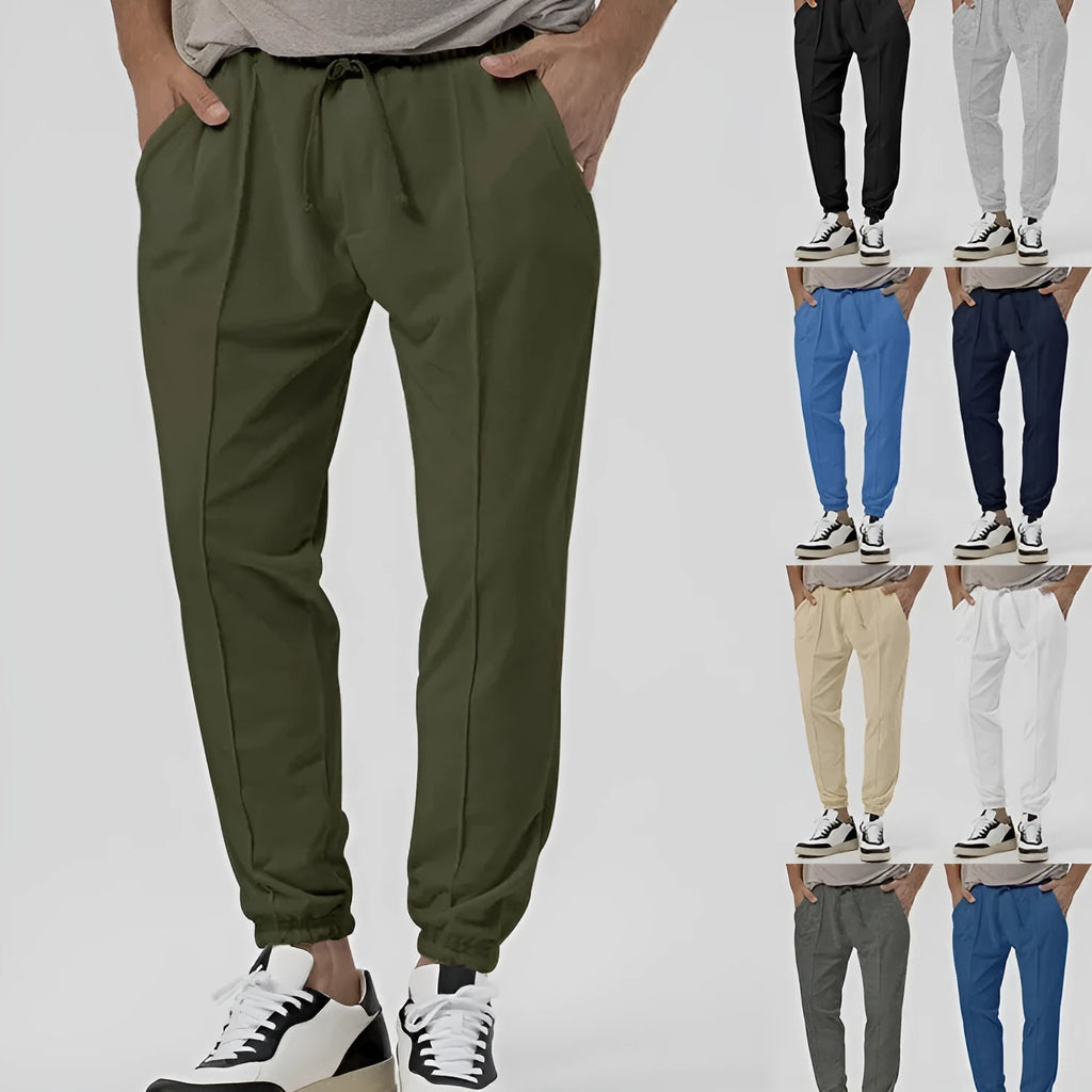 Men's grey casual track sweatpants with straight-leg design and mid waist, made from polyester blend elastic fabric