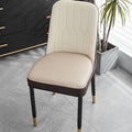 Brown leather horseshoe-shaped seat cushion on a wooden chair, showing non-slip base.