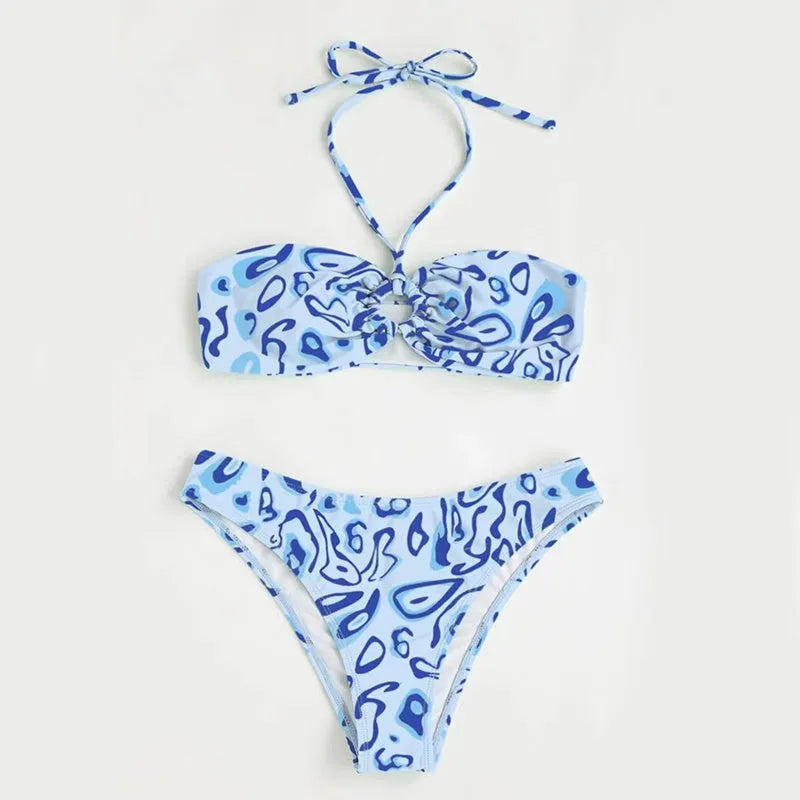 Green floral bandeau bikini with split design and backless styling on swimwear model