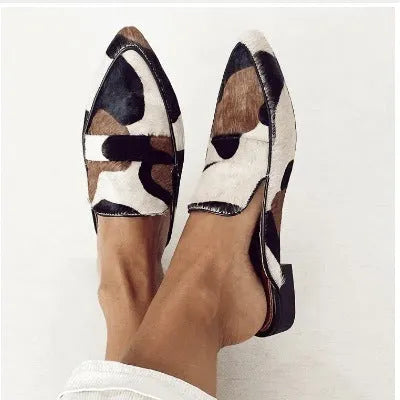 Women's black and white apricot imitation horse hair retro pointed-toe low heel shoes with suede upper.