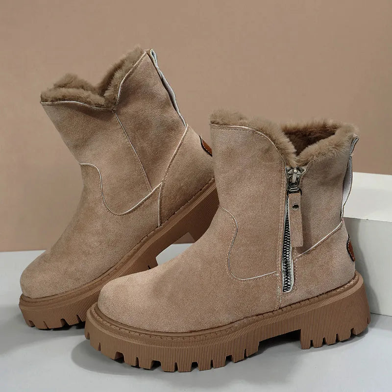 Women's black faux suede high-top snow boots with side zipper and faux fur lining.