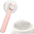 Self cleaning cat brush with blue rubber handle and metal pins with round tips