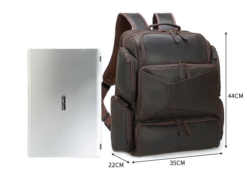 Dark brown genuine leather men's backpack showing 17-inch computer compartment and multiple interior pockets